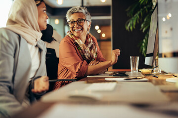 Diverse businesswomen working together in a creative office