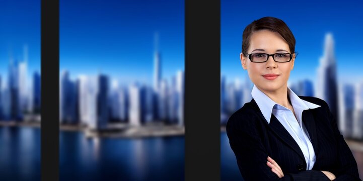 Successful Businesswoman Working In Office With City View