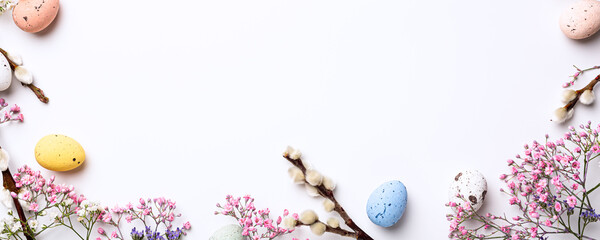 Beautiful Easter composition with spring flowers and colorful quail eggs over white background....