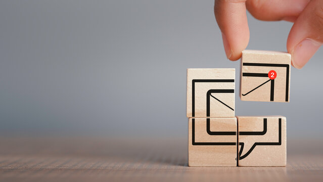 New email notification concept. In box alert and notification icon on wood cubes stack with copy space, Business e-mail communication and digital marketing. Newsletter, online working. - Powered by Adobe