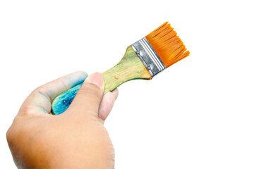 Human hand holding dirty paintbrushes