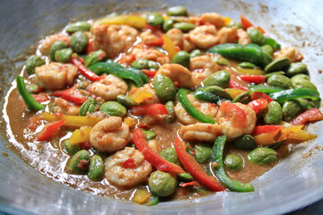 Thai food in a pan Spicy stir-fry with prawns, broccoli and shrimp paste