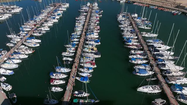 Boats and small sailing Yachts docked in a beautiful marina