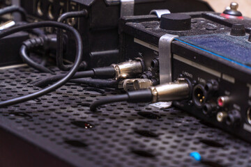 Audio jacks are plugged into a guitar synthesizer or processor