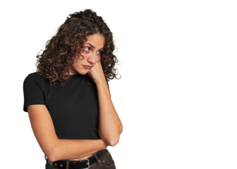 Radiant young woman with stunning curls who feels sad and pensive, looking at copy space.