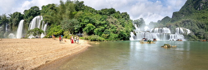 Ban Gioc Waterfall, Cao Bang Province, Vietnam - View panorama of Ban Gioc Waterfall on a sunny beautifull day. This is the largest and most beautiful waterfall in Southeast Asia. © Quang