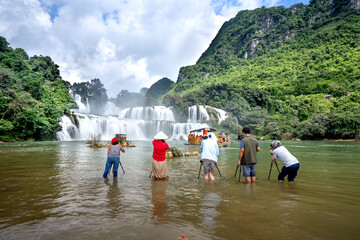 Ban Gioc Waterfall, Cao Bang Province, Vietnam - View panorama of Ban Gioc Waterfall on a sunny beautifull day. This is the largest and most beautiful waterfall in Southeast Asia.