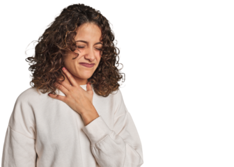 Radiant young woman with stunning curls suffers pain in throat due a virus or infection.