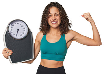 Success on the scale! This dedicated athlete celebrates her hard work, sacrifice, and progress towards her goals.