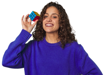 A young caucasian woman playing a logic game cube