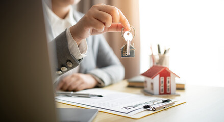 Fototapeta na wymiar Business people signing contract making deal with real estate agent Concept for consultant home insurance.Real estate investment Property insurance security. Real estate agent offer house