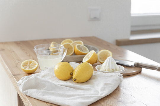 Making a refreshing summer drink. Preparing lemonade in the kitchen. Healthy food concept