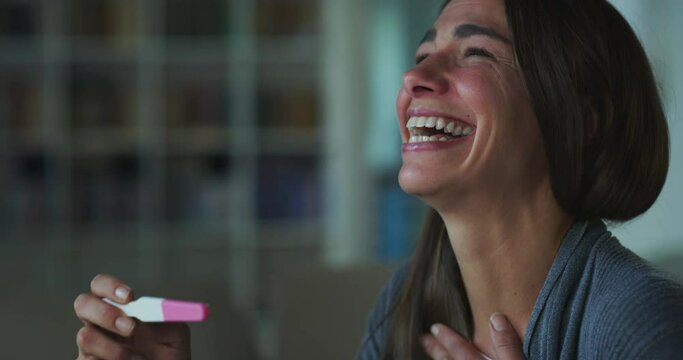 Portrait of a Happy and Thrilled Woman in Disbelief Getting Positive Results on a Pregnancy Test. A Female, Soon to be a Mother, Getting Excited about the Happy News, Feeling Thankful for the Blessing