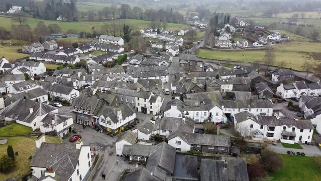 Cinematic aerial drone footage of Hawkshead Village and St Michael and All Angels Church.Cumbria UK.