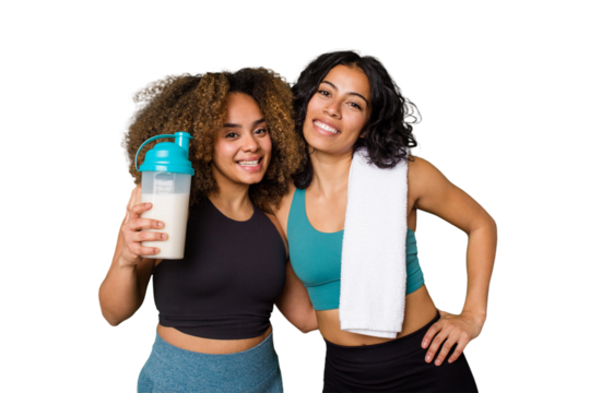 Two best friends are ready to go to the gym, one of them holds a protein shake, happy, smiling and cheerful.