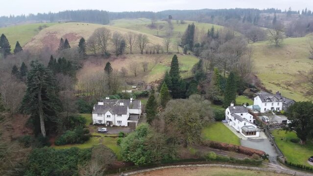 Cinematic aerial drone footage of Hawkshead Village and St Michael and All Angels Church.Cumbria UK.