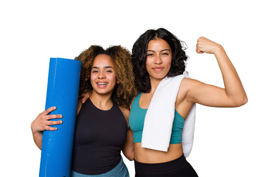 Two friends, of different ethnicities, are pumped and ready to hit the gym together.
