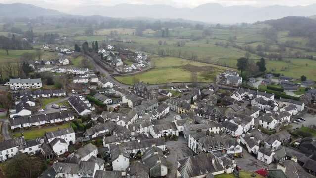 Cinematic aerial drone footage of Hawkshead Village and St Michael and All Angels Church.Cumbria UK.