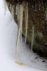 icicles on a frozen stone, winter landscape