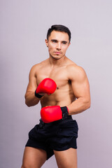 Boxing gloves, man training in sports fight, challenge or mma competition on studio background.