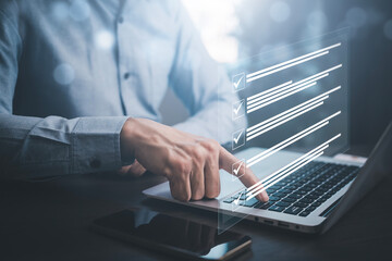 Businessman working laptop and Taking an assessment, questionnaire, evaluation, online survey online exam Choosing the right answer in exam by filling out the online survey form,Answer  test questions