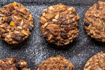 Mini Christmas puddings, diabetes type 2 friendly, with no added sugar on a baking tray, an excellent snack for those who suffer from diabetes.