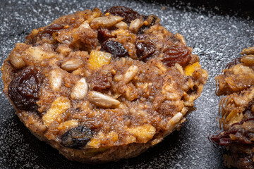Close-up of a homemade diabetes-friendly mini Christmas puddings  on a baking tray with no added sugar, especially for those who suffer from daibetese type 2