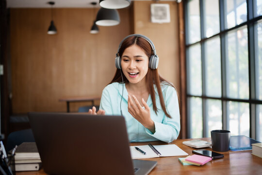Young asian student watching lesson online and studying . online education concept