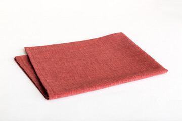 top view with red empty kitchen napkin isolated on table background. Folded cloth for mockup with copy space, Flat lay. Minimal style