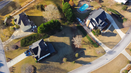 Low density residential neighborhood with upscale two-story houses, swimming pool, well-trimmed no...