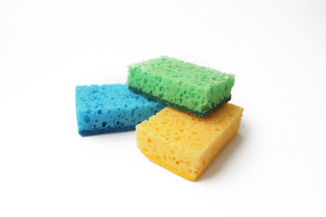 Multicolored sponges for washing dishes isolated on white background