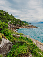Tropical coastline with plants, amazing rocks and ocean in Brazil.