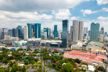 Mandaluyong, Metro Manila, Philippines - The Ortigas Skyline and Wack Wack Village. SM Megamall and Shangri-La Mall visible in aerial photo.