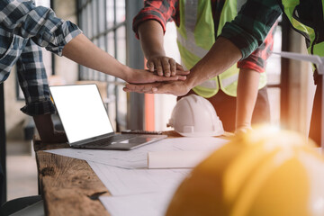 Team architects workers  join hands to join forces to join forces to work for the industry for success. Teamwork and professional colleagues : Workers' hands, teamwork concept.