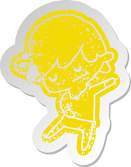 distressed old sticker of a kawaii cute boy