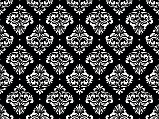Wallpaper in the style of Baroque. Seamless vector background. White and black floral ornament. Graphic pattern for fabric, wallpaper, packaging. Ornate Damask flower ornament