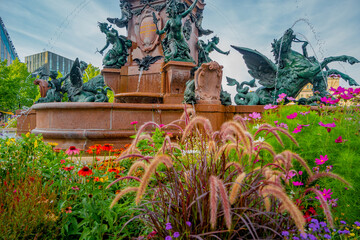 Leipzig, Germany – August 7, 2022: View over multiple colorful flowers and fountain in the...