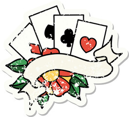 traditional distressed sticker tattoo of cards and banner