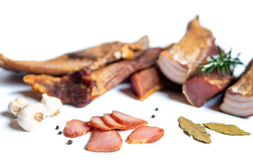Dried pork meat smoked on traditional way with garlic , rosemary and pepper isolated on white background.