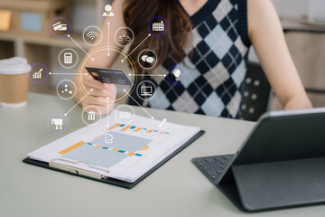 Businessman use credit card to shopping online in internet website shop with computer laptop on work table in office.