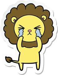 sticker of a cartoon crying lion