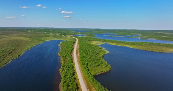 Aerial view of a esker in middle of lakes in Kevo and Kaldoaivi wilderness, summer in Lapland