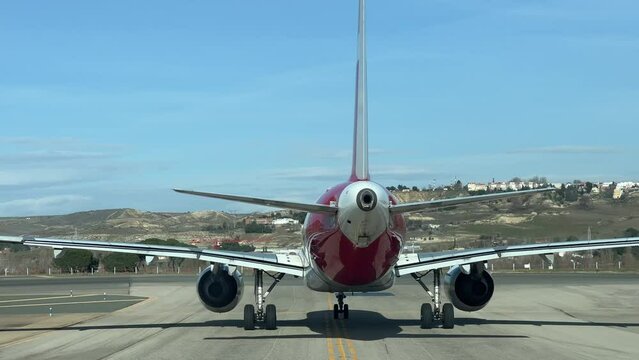 Rear view of a A320 taxiing ahead on a taxiway ready for take-off. Pilot point of view.