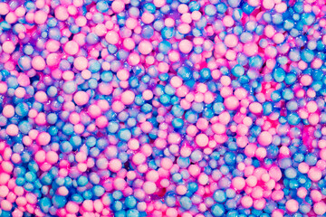 Slime with balls as background and texture. Slime balls. Pool with balls for fun and children's...