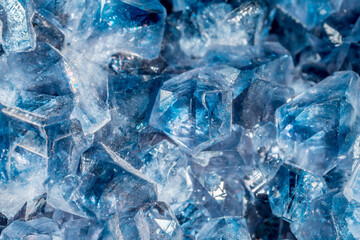 Blue Crystal Mineral Stone. Gems. Mineral crystals in the natural environment. Texture of precious and semiprecious stones. Seamless background with copy space colored shiny surface of precious stones