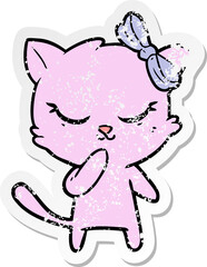 distressed sticker of a cute cartoon cat with bow