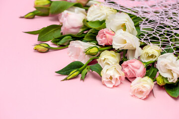 Festive bouquet of flowers for the beloved on a pink background. The concept of love congratulations on the wedding, March 8, Valentine's Day, Christmas and birthday. Copy space.