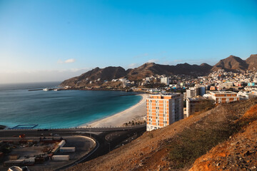 Mindelo is a vibrant port city located on the island of S&atilde;o Vicente in Cabo Verde. Known for its colorful colonial buildings, lively music scene, and stunning beaches, Mindelo is a destination.