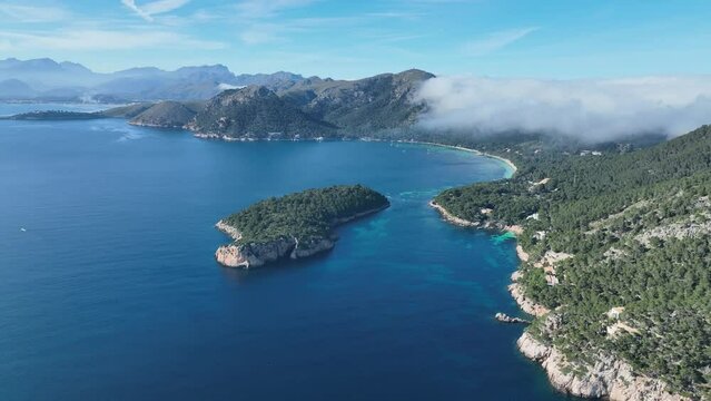 Aerial view of Formentor Peninsula with Formentor Beach, Hotel Royal Hideaway Formentor formerly Hotel Formentor, Cala Pi de la Posada, Illa del Geret Port de Pollenca, Mallorca, Spain .