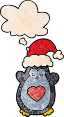 cute christmas penguin and thought bubble in grunge texture pattern style